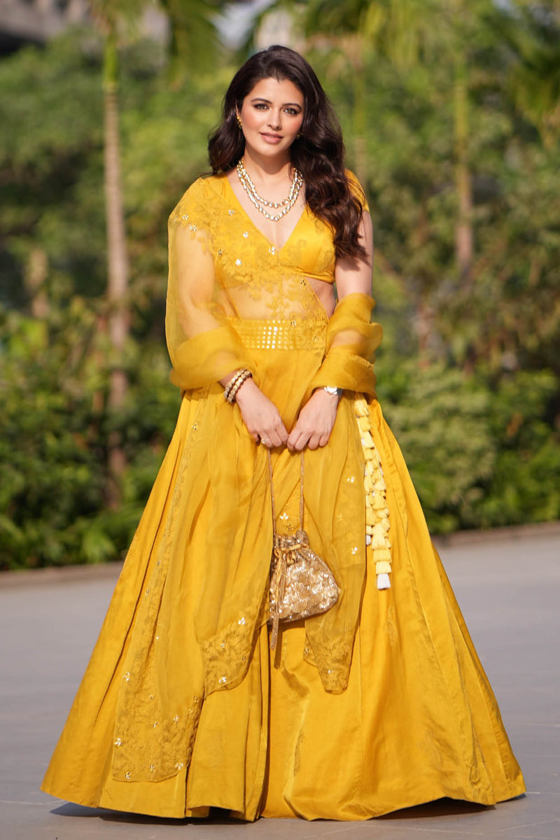 Natasha Luthra in Mustard Yellow Embroidered Cotton Silk Satin Lehenga Set